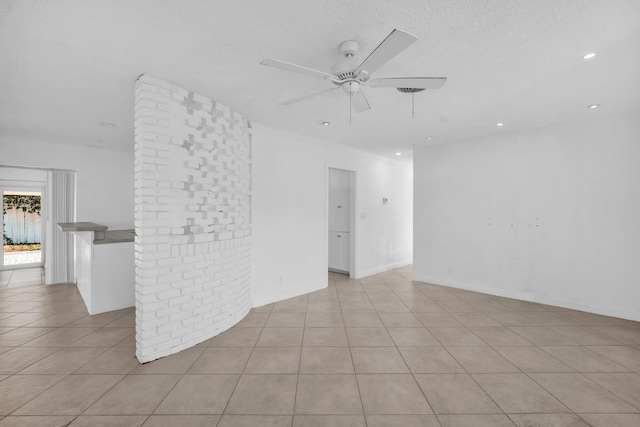 2230 NE 62nd St, Fort Lauderdale, FL 33308 - unfurnished living room featuring a ceiling fan, tile patterned floors, recessed lighting, and a textured ceiling