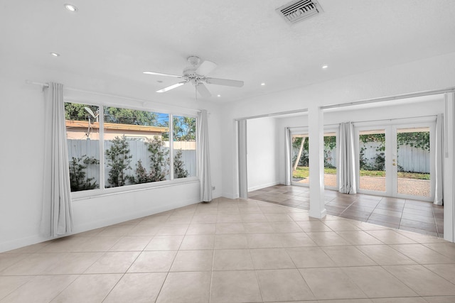 2230 NE 62nd St, Fort Lauderdale, FL 33308 - unfurnished room with healthy amount of natural light, recessed lighting, ceiling fan, light tile patterned flooring, and french doors