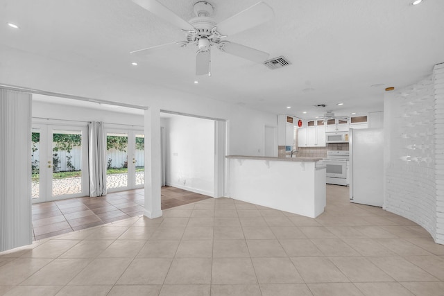 2230 NE 62nd St, Fort Lauderdale, FL 33308 - unfurnished living room with ceiling fan, recessed lighting, light tile patterned floors, a sink, and french doors