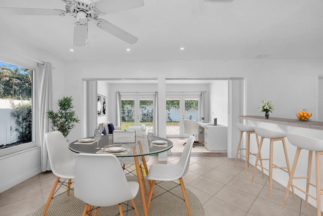 2230 NE 62nd St, Fort Lauderdale, FL 33308 - dining room with french doors, plenty of natural light, light tile patterned flooring, a ceiling fan, and recessed lighting