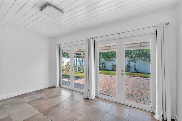 2230 NE 62nd St, Fort Lauderdale, FL 33308 - entryway featuring french doors, baseboards, and wood ceiling
