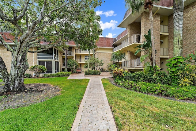 view of home's community featuring a lawn