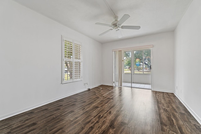 empty room featuring wood finished floors, ceiling fan, and baseboards