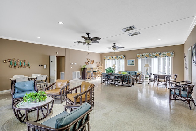living area featuring ornamental molding, ceiling fan, speckled floor, baseboards, and recessed lighting