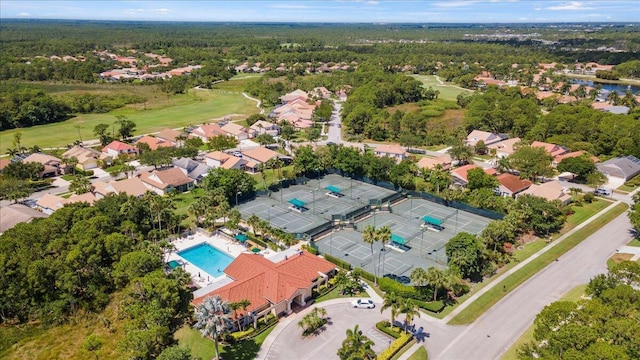 aerial view of residential area featuring a pool area and a golf club
