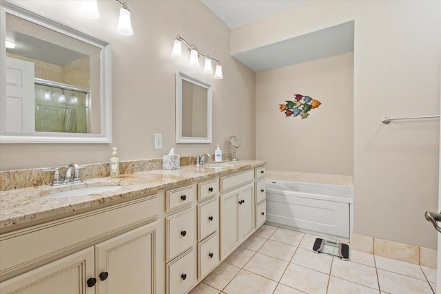 full bath featuring tile patterned floors, a garden tub, double vanity, and a stall shower