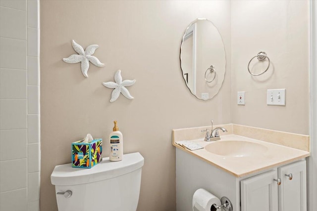 bathroom featuring toilet and vanity