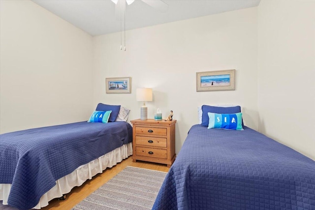 bedroom with wood finished floors and a ceiling fan