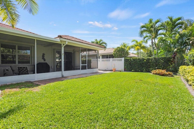 view of yard featuring a sunroom