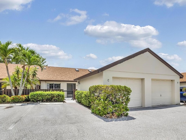 1574 SW Silver Pine Way Unit 105-C, Palm City, FL 34990 - ranch-style house featuring stucco siding and roof with shingles