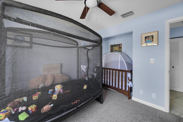 bedroom with baseboards, ceiling fan, and carpet