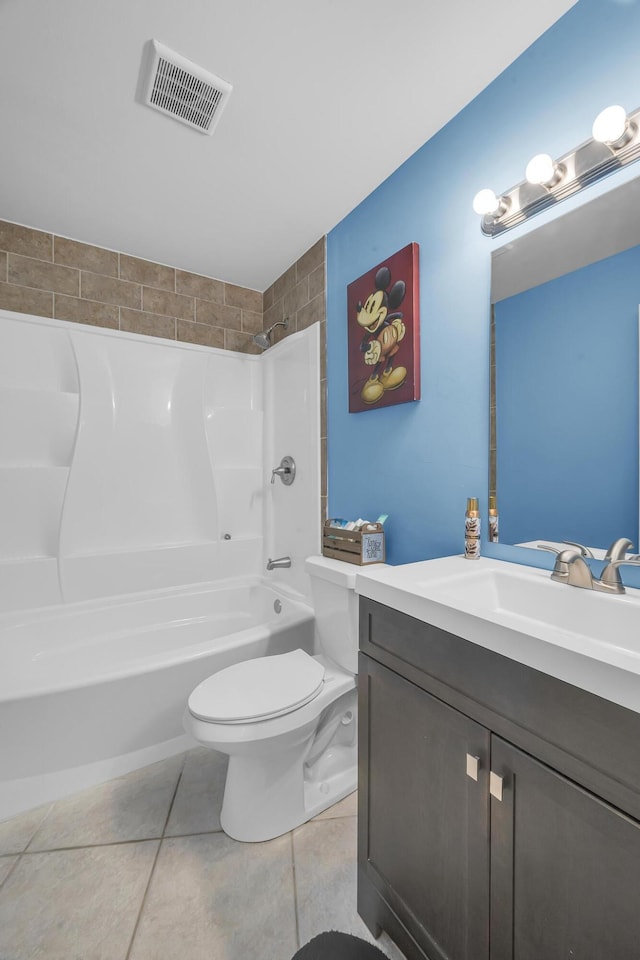 full bathroom featuring tile patterned floors, toilet, vanity, and shower / bath combination