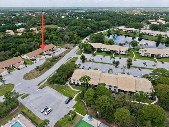 aerial view of property's location with a nearby body of water