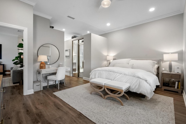 bedroom featuring ornamental molding, dark wood-style floors, baseboards, and recessed lighting