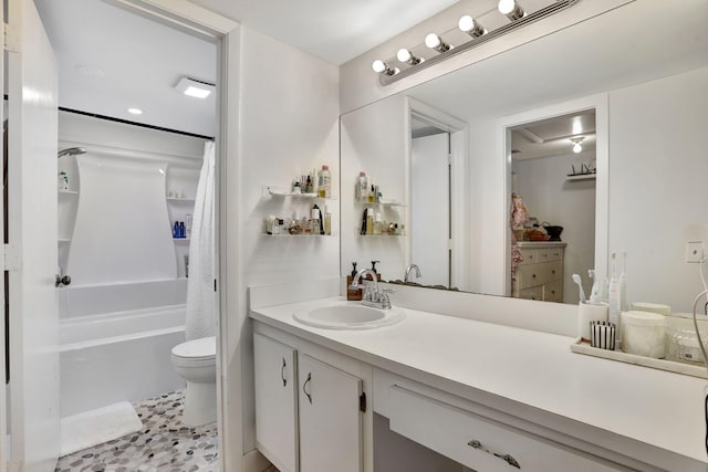 bathroom featuring toilet, vanity, and shower / bathtub combination with curtain