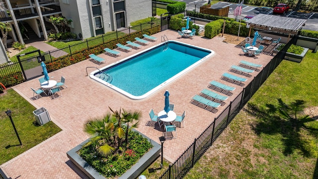 community pool featuring a patio and central AC