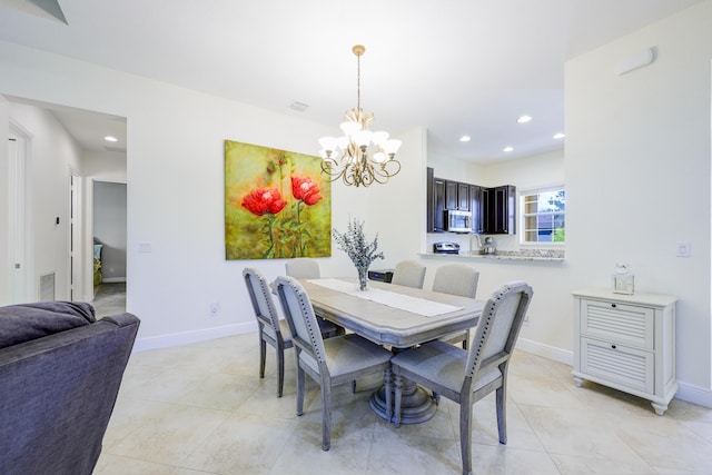 10250 SW Azzo Ln, Port Saint Lucie, FL 34986 - dining room with a chandelier, recessed lighting, light tile patterned floors, and baseboards