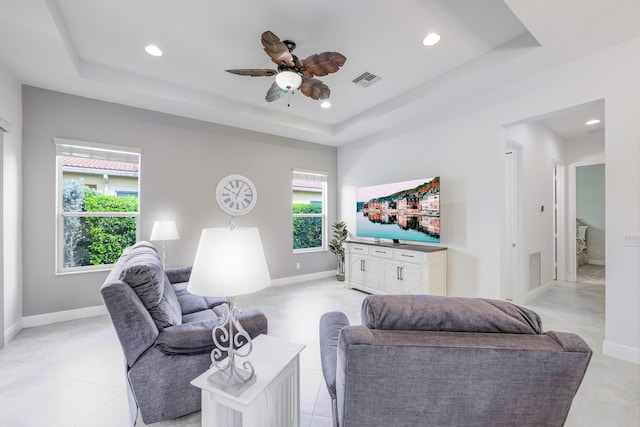 10250 SW Azzo Ln, Port Saint Lucie, FL 34986 - living room with a raised ceiling, ceiling fan, recessed lighting, and baseboards