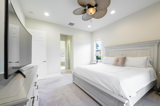 10250 SW Azzo Ln, Port Saint Lucie, FL 34986 - bedroom featuring light carpet, multiple windows, recessed lighting, baseboards, and a ceiling fan
