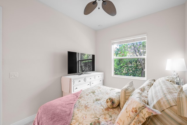 10250 SW Azzo Ln, Port Saint Lucie, FL 34986 - bedroom featuring baseboards and a ceiling fan
