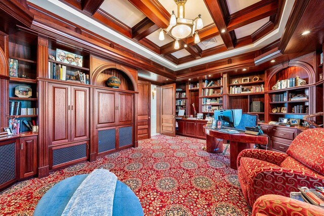 3066 SE Dune Dr, Stuart, FL 34996 - carpeted office with beamed ceiling, built in study area, coffered ceiling, crown molding, and built in features