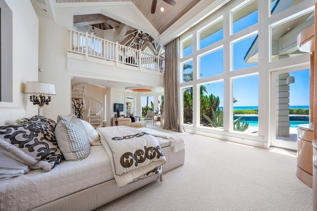 3066 SE Dune Dr, Stuart, FL 34996 - carpeted bedroom featuring high vaulted ceiling and access to exterior