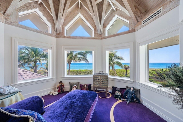 3066 SE Dune Dr, Stuart, FL 34996 - sunroom with plenty of natural light, a water view, carpet, baseboards, and high vaulted ceiling