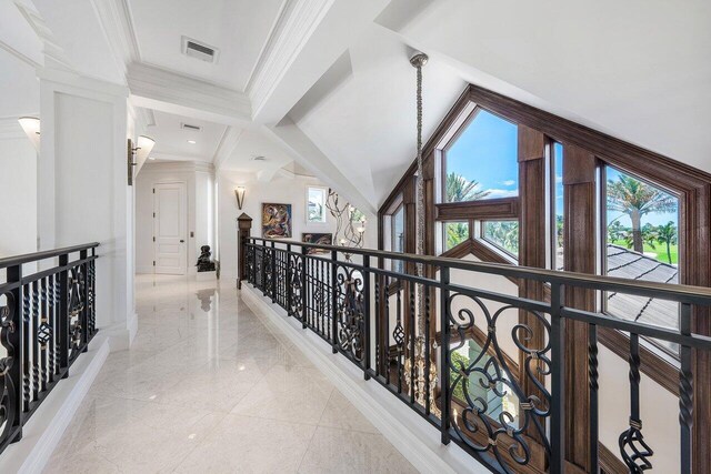 3066 SE Dune Dr, Stuart, FL 34996 - hall featuring an upstairs landing, ornamental molding, and light marble finish flooring
