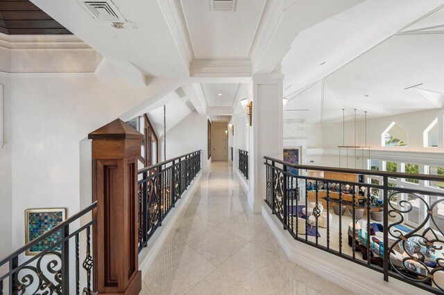 3066 SE Dune Dr, Stuart, FL 34996 - corridor with an upstairs landing, ornamental molding, baseboards, and decorative columns
