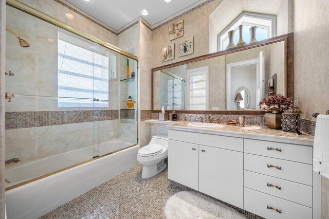 3066 SE Dune Dr, Stuart, FL 34996 - bathroom with enclosed tub / shower combo, vanity, toilet, and tile patterned flooring