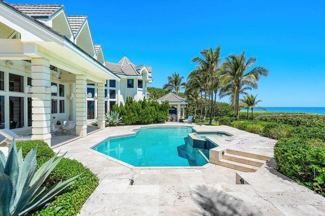 3066 SE Dune Dr, Stuart, FL 34996 - view of pool featuring a patio area and a pool with connected hot tub