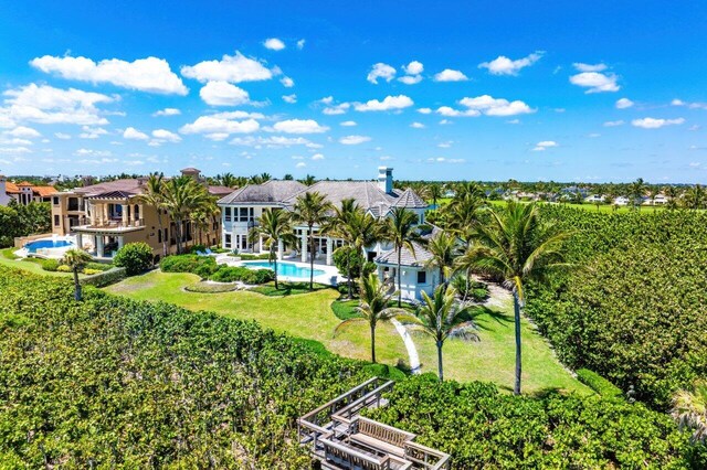 3066 SE Dune Dr, Stuart, FL 34996 - back of property featuring an outdoor pool