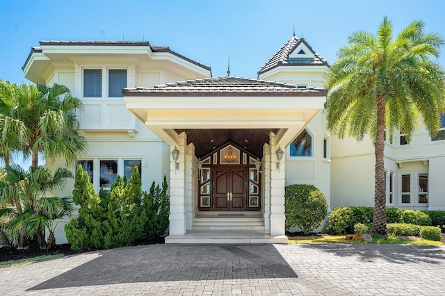 3066 SE Dune Dr, Stuart, FL 34996 - view of exterior entry featuring stucco siding