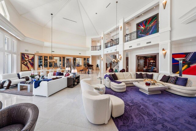 3066 SE Dune Dr, Stuart, FL 34996 - community lobby featuring a high ceiling and crown molding