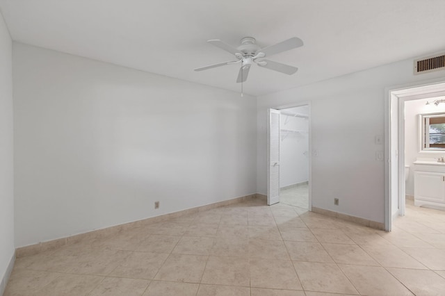 228 Brittany E, Delray Beach, FL 33446 - unfurnished room with ceiling fan and light tile patterned floors
