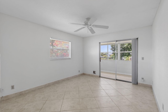 228 Brittany E, Delray Beach, FL 33446 - spare room with a ceiling fan and light tile patterned floors
