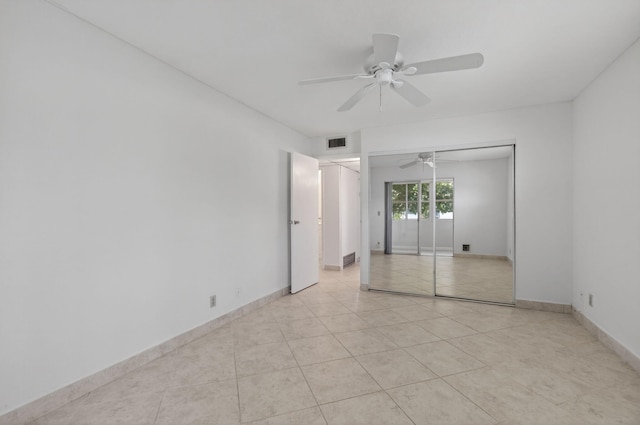 228 Brittany E, Delray Beach, FL 33446 - unfurnished room with a ceiling fan and light tile patterned floors