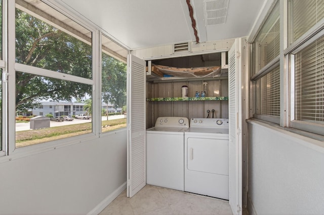 228 Brittany E, Delray Beach, FL 33446 - laundry room featuring washer and dryer and tile patterned floors