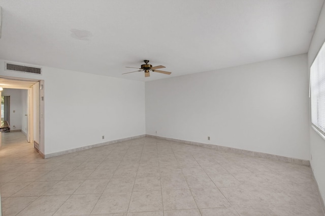 228 Brittany E, Delray Beach, FL 33446 - empty room with ceiling fan and light tile patterned flooring