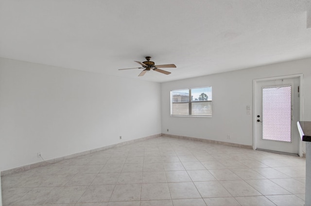 228 Brittany E, Delray Beach, FL 33446 - unfurnished room with a ceiling fan and light tile patterned floors