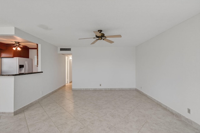 228 Brittany E, Delray Beach, FL 33446 - spare room featuring ceiling fan and light tile patterned flooring