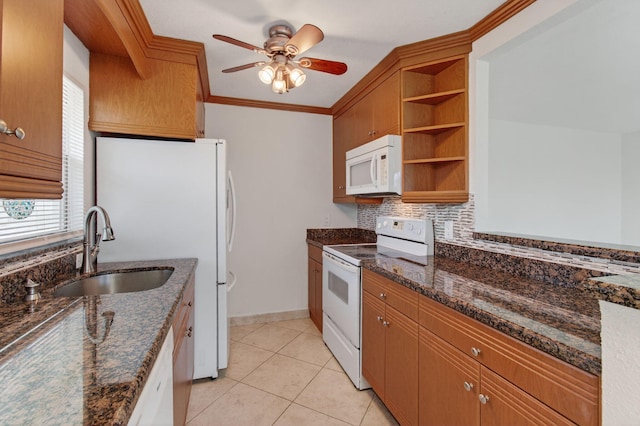 228 Brittany E, Delray Beach, FL 33446 - kitchen with white appliances, a ceiling fan, open shelves, decorative backsplash, and dark stone counters