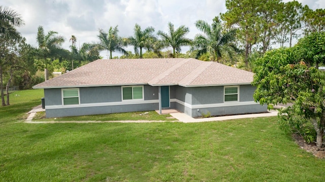 16594 90th St N, Loxahatchee, FL 33470 - single story home with stucco siding, a front yard, and roof with shingles