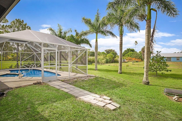 16594 90th St N, Loxahatchee, FL 33470 - swimming pool featuring a yard, a patio area, and a lanai