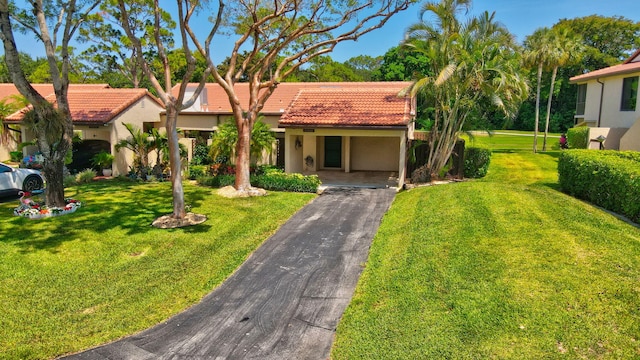 21922 Cypress Dr Unit 37B, Boca Raton, FL 33433 - mediterranean / spanish house with asphalt driveway, a tiled roof, stucco siding, and a front yard
