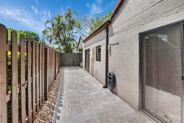 21922 Cypress Dr Unit 37B, Boca Raton, FL 33433 - view of home's exterior featuring stucco siding, fence, and a patio