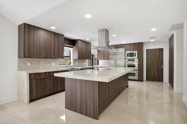 21922 Cypress Dr Unit 37B, Boca Raton, FL 33433 - kitchen featuring built in appliances, modern cabinets, decorative backsplash, a spacious island, and island exhaust hood