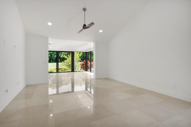 21922 Cypress Dr Unit 37B, Boca Raton, FL 33433 - spare room featuring expansive windows, ceiling fan, baseboards, lofted ceiling, and tile patterned flooring