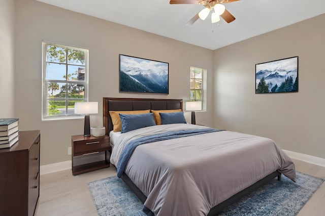 7655 Cinebar Dr Unit 105, Boca Raton, FL 33433 - bedroom featuring baseboards and ceiling fan