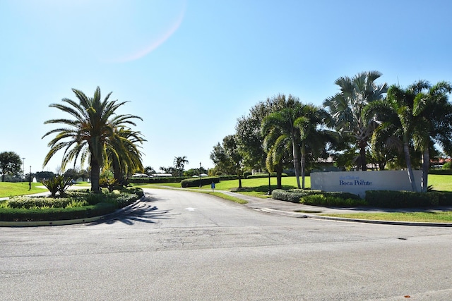 7655 Cinebar Dr Unit 105, Boca Raton, FL 33433 - view of asphalt road with curbs and sidewalks